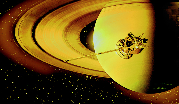 The Cassini probe passes before the face of Saturn
