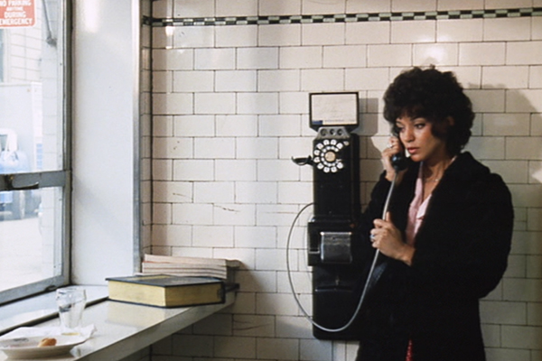Vonetta McGee makes a phone call in the movie Detroit 9000.