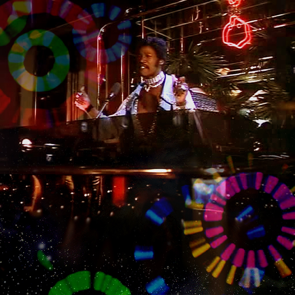 Rudy Ray Moore IS Disco Godfather, spinning in the club amidst a psychedelic kaleidoscope of sound