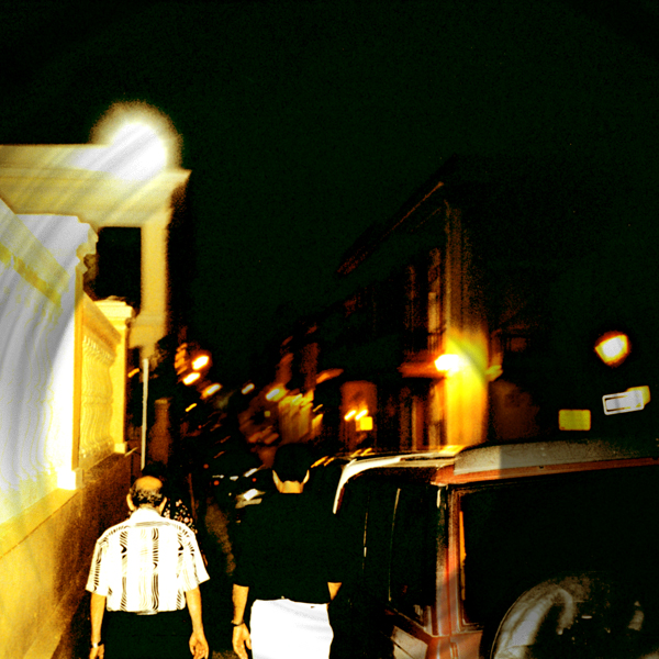 A photo snapped while following Papo and Torres as they walk down the street