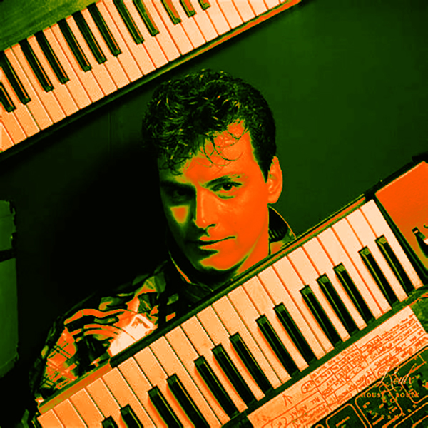 Man Parrish, poised with two simple synthesizers (and immaculate hair)