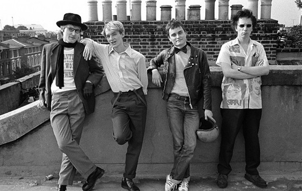 Public Image Ltd. standing on a rooftop
