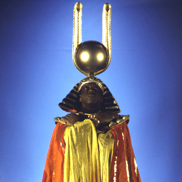 Sun Ra striking the Pharaoh's pose decked out in ceremonial garb