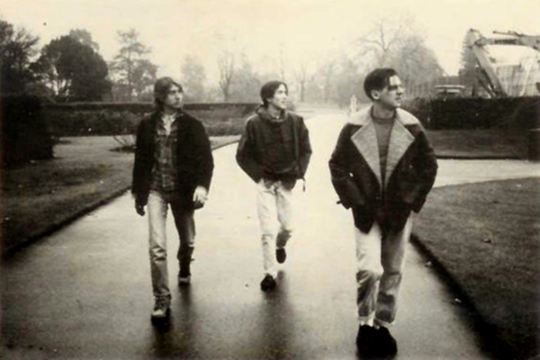 The trio look on, walking in unison