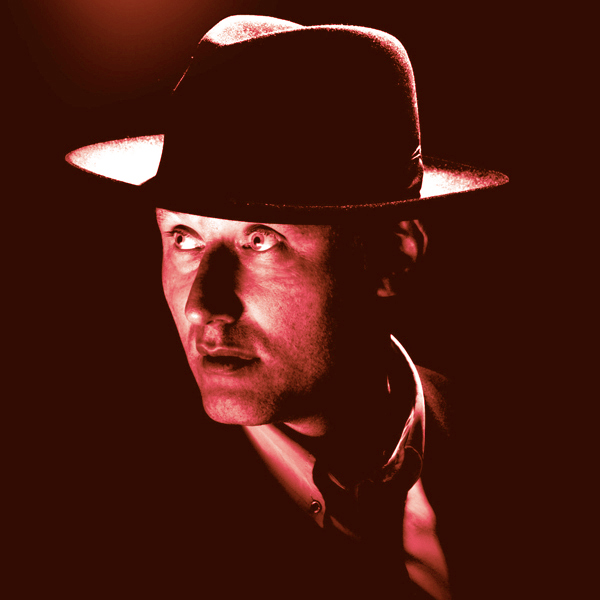 Jah Wobble looking dapper in a suit and fedora