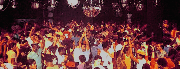 Club goers dancing in a sweaty music hall
