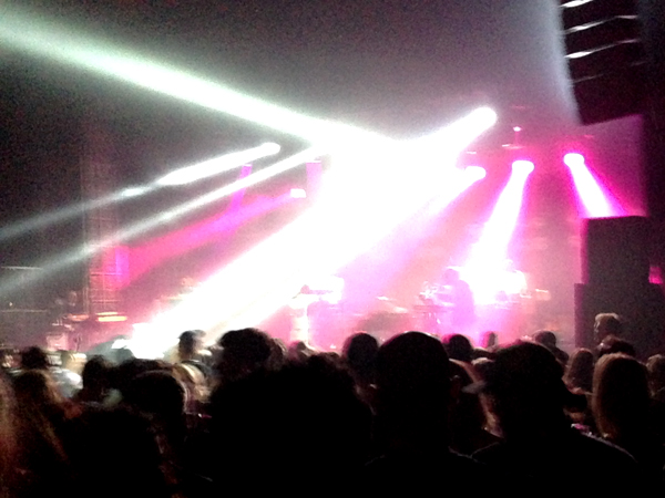 Hot Chip performs under neon lights